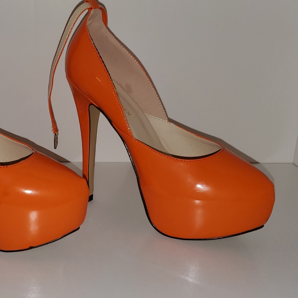 Pretty and sexy patent orange stilettos with strap